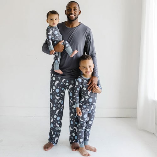 dad and two children in little sleepies pajamas