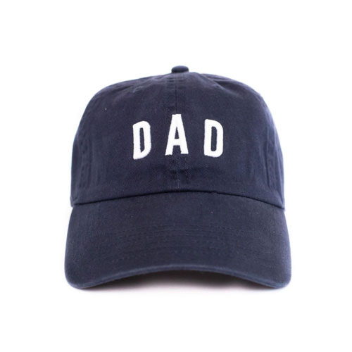 navy baseball cap that says "DAD" in white lettering