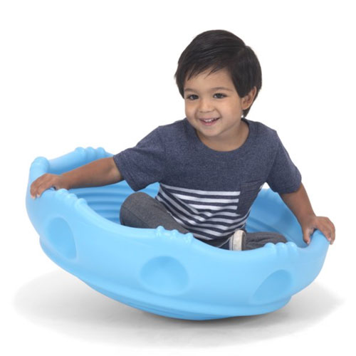 smiling child sitting inside a blue wobble disk