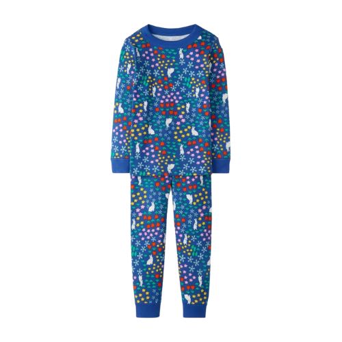dark blue kids long john pajamas in an allover print of white bunnies in a field of flowers