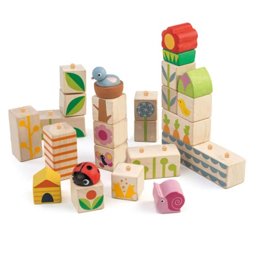 pile of nature themed wooden garden blocks