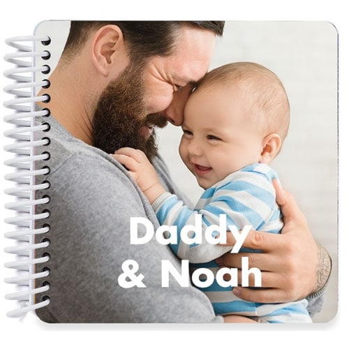 spiraled board book with photo of dad and baby that says "Daddy & Noah"