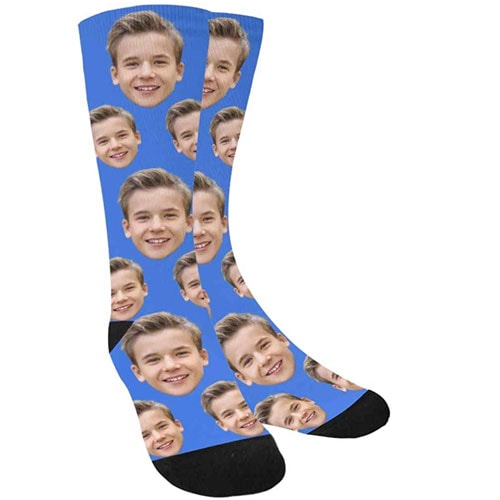 tall blue socks with boys face and black heel and toe